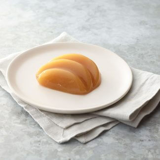 Thick and Easy Shaped Pureed Frozen peaches on a table