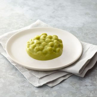 Thick and Easy Shaped Pureed Frozen peas on a table